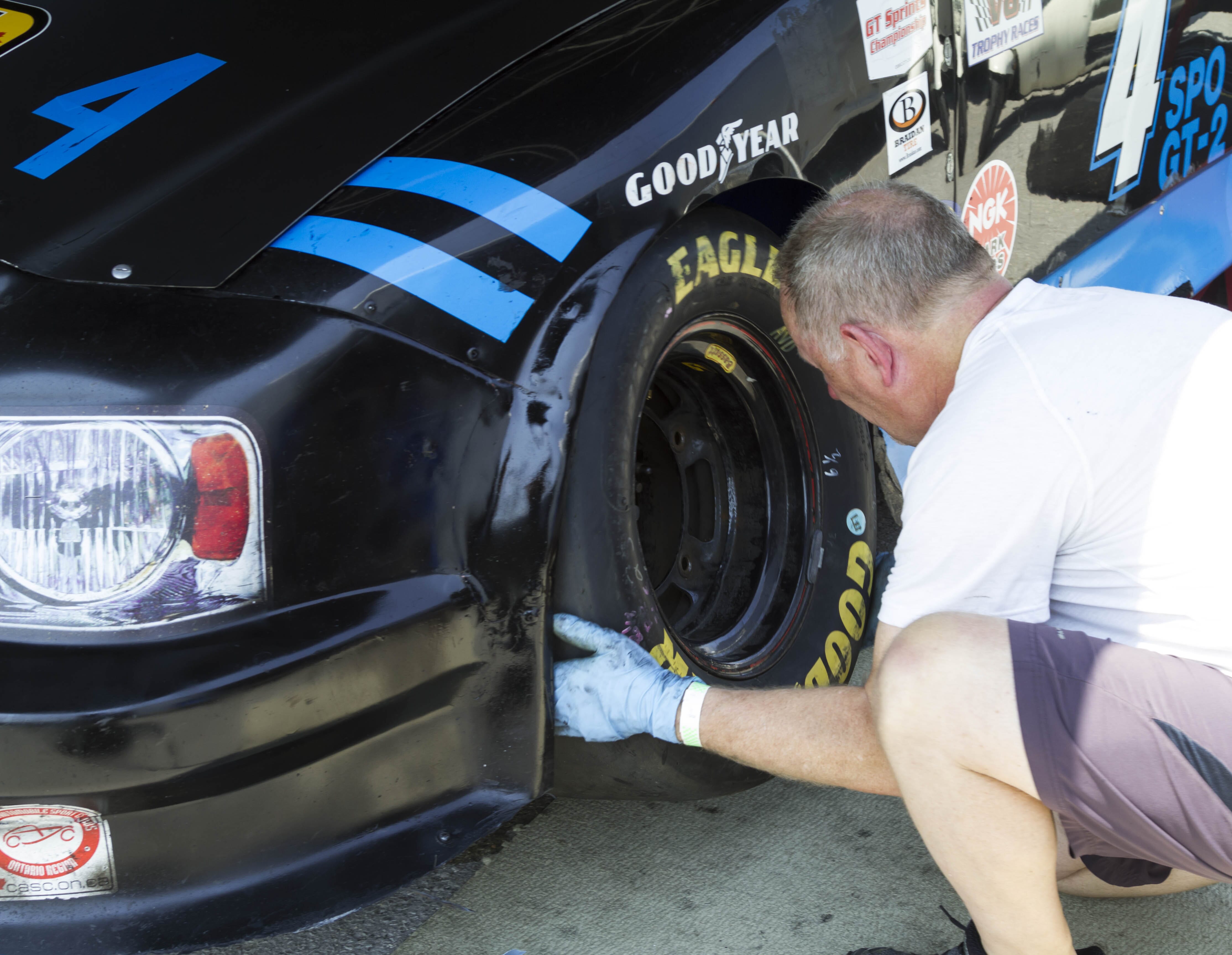 Chris is his own pit crew, seen here changing a tire before the race.
