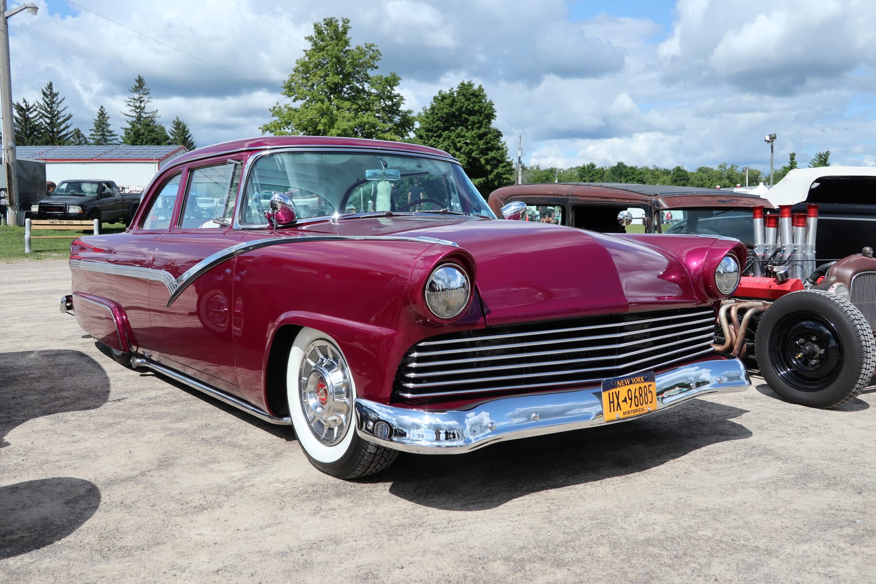 1956 Ford Fairlane pink with whitewall tires visiting from New York