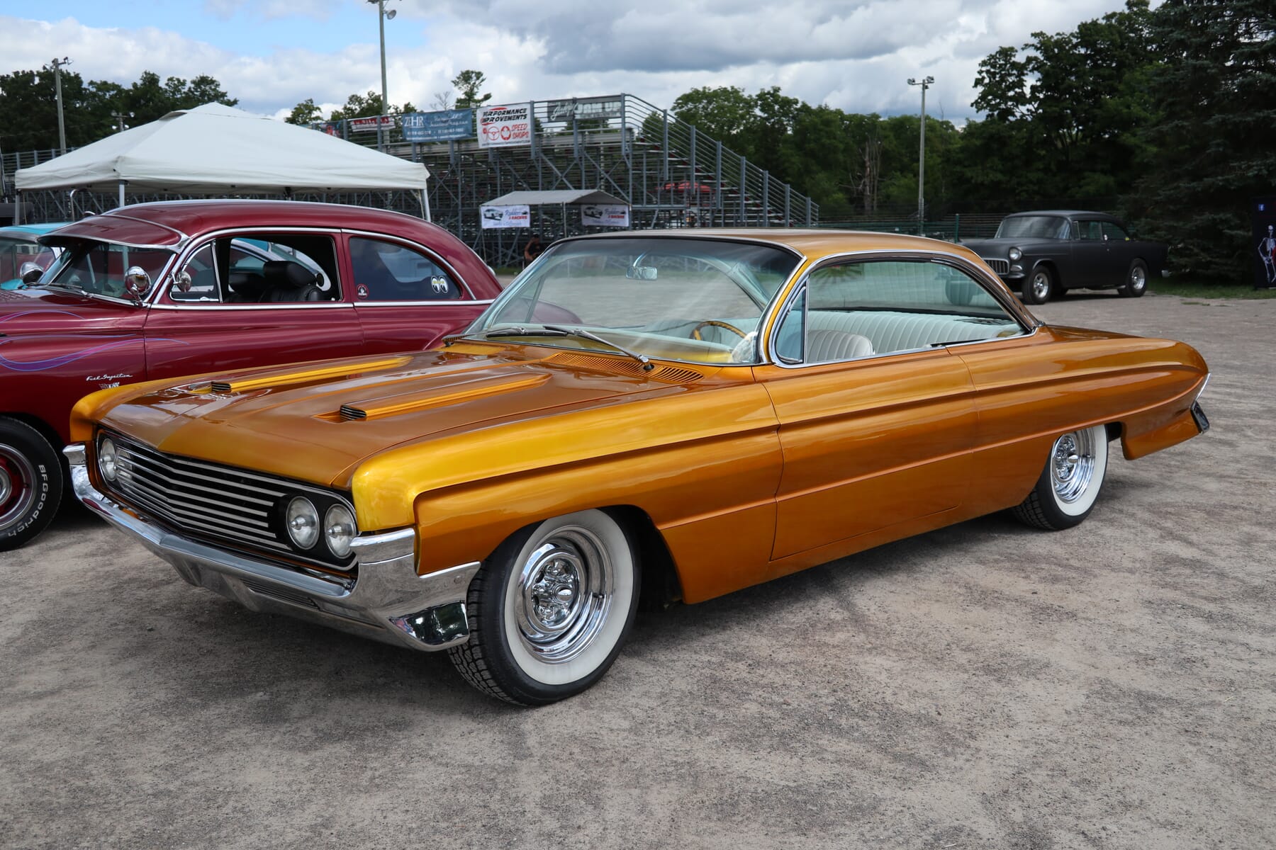 1961 Oldsmobile Super 88 with a unique sunset color and whitewall tires