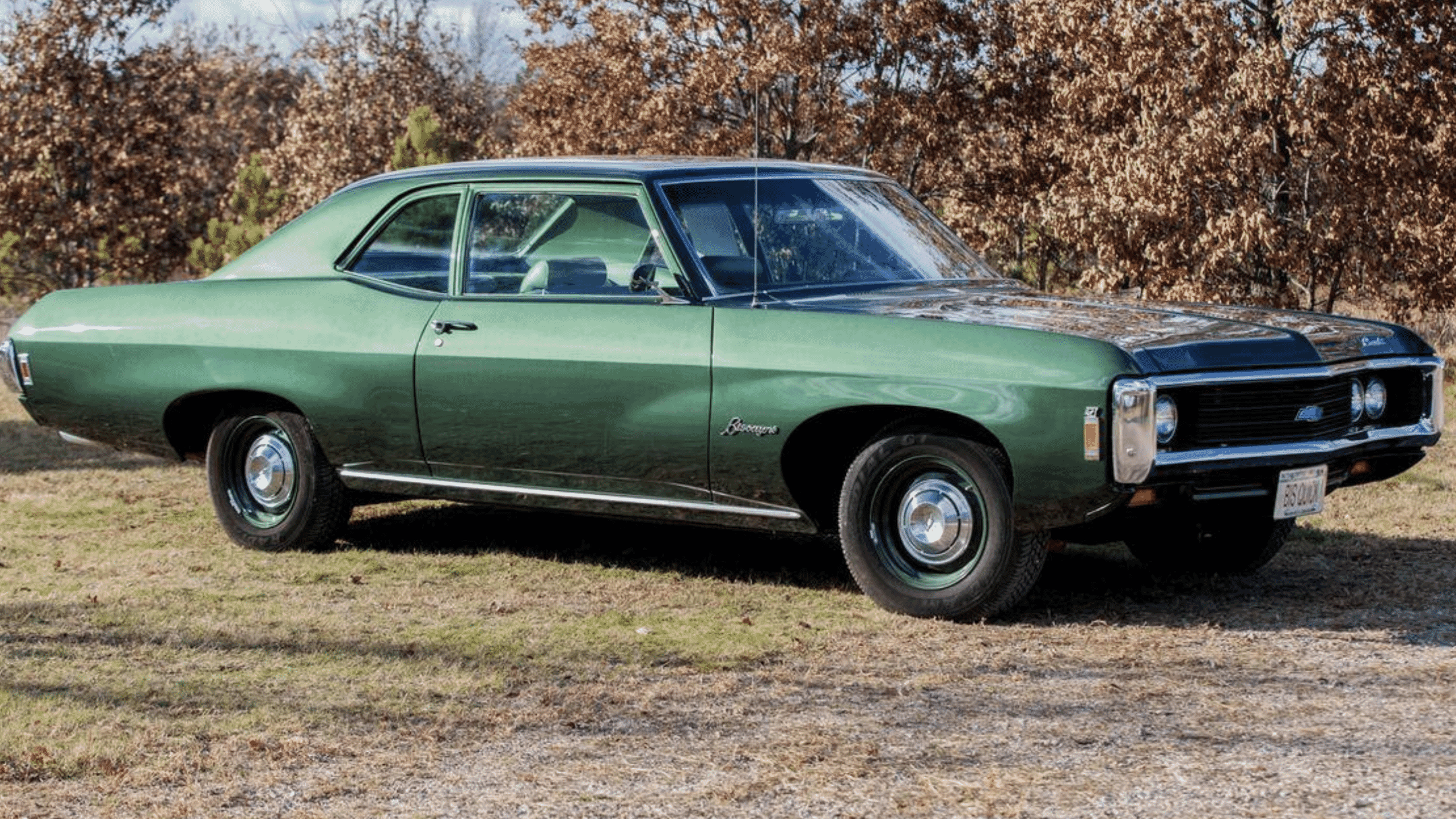 Side view of a green 1969 Chevrolet Biscayne two door hardtop